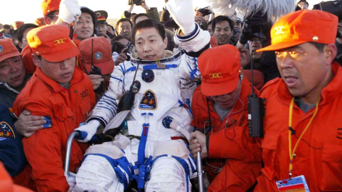 CHINA, SIZIWANG (Inner Mongolia), Oct. 16, 2003. Yang Liwei, China's first astronaut, waves to the people around him in the chief langing spot at north China's Inner Mongolia at 6:23 a.m. Thursday. (Photo by: Sovfoto/UIG via Getty Images)